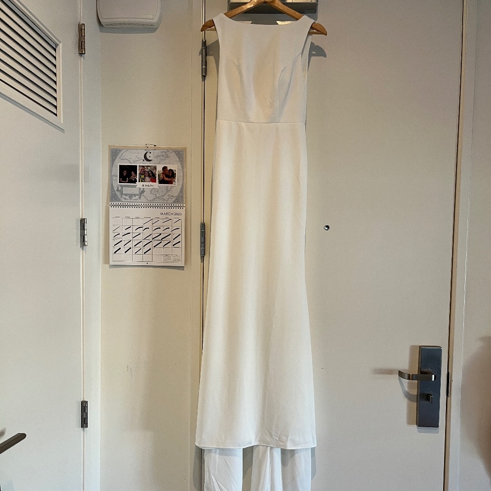 Simple white wedding dress with bateau neckline